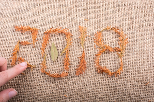 Floral embroidered patch on linen